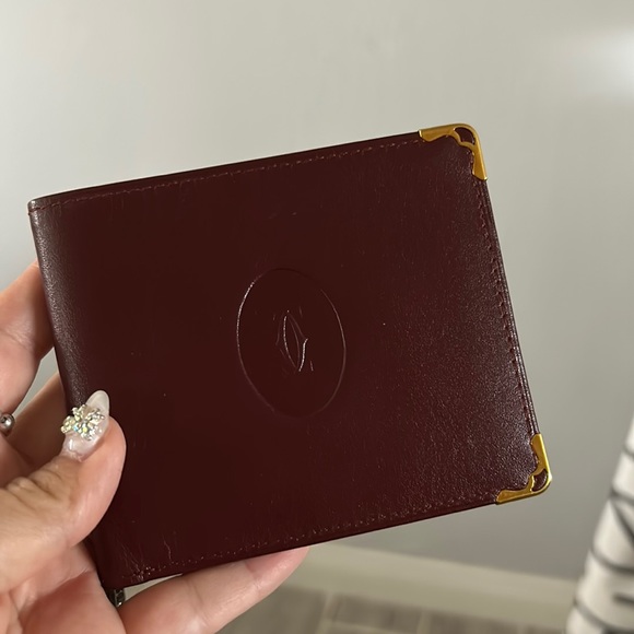 Cartier wallet great condition has three slots a place to put bills